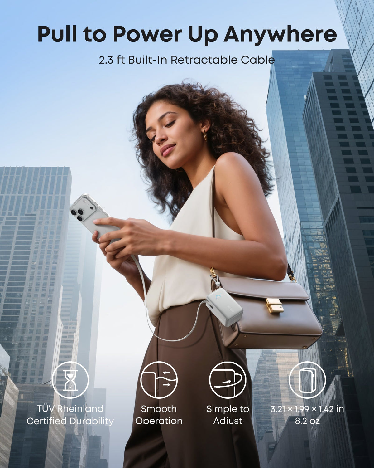 Anker portable power bank with retractable cable for city charging.